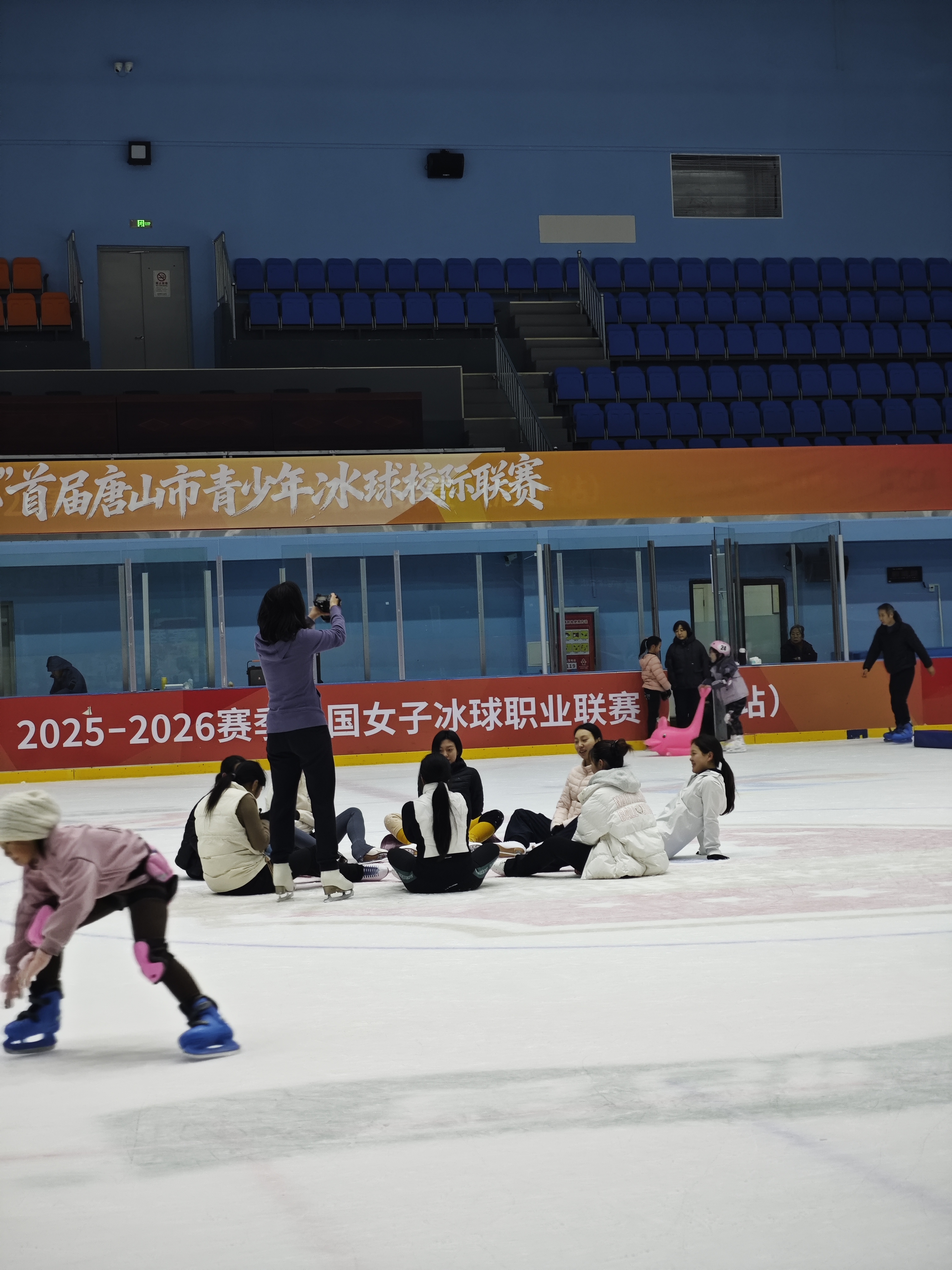 Adult learners gathering together beside the ice rink